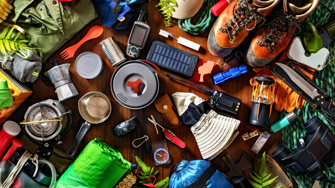 Essential gear overland camping on a table. I Go Overland Blog